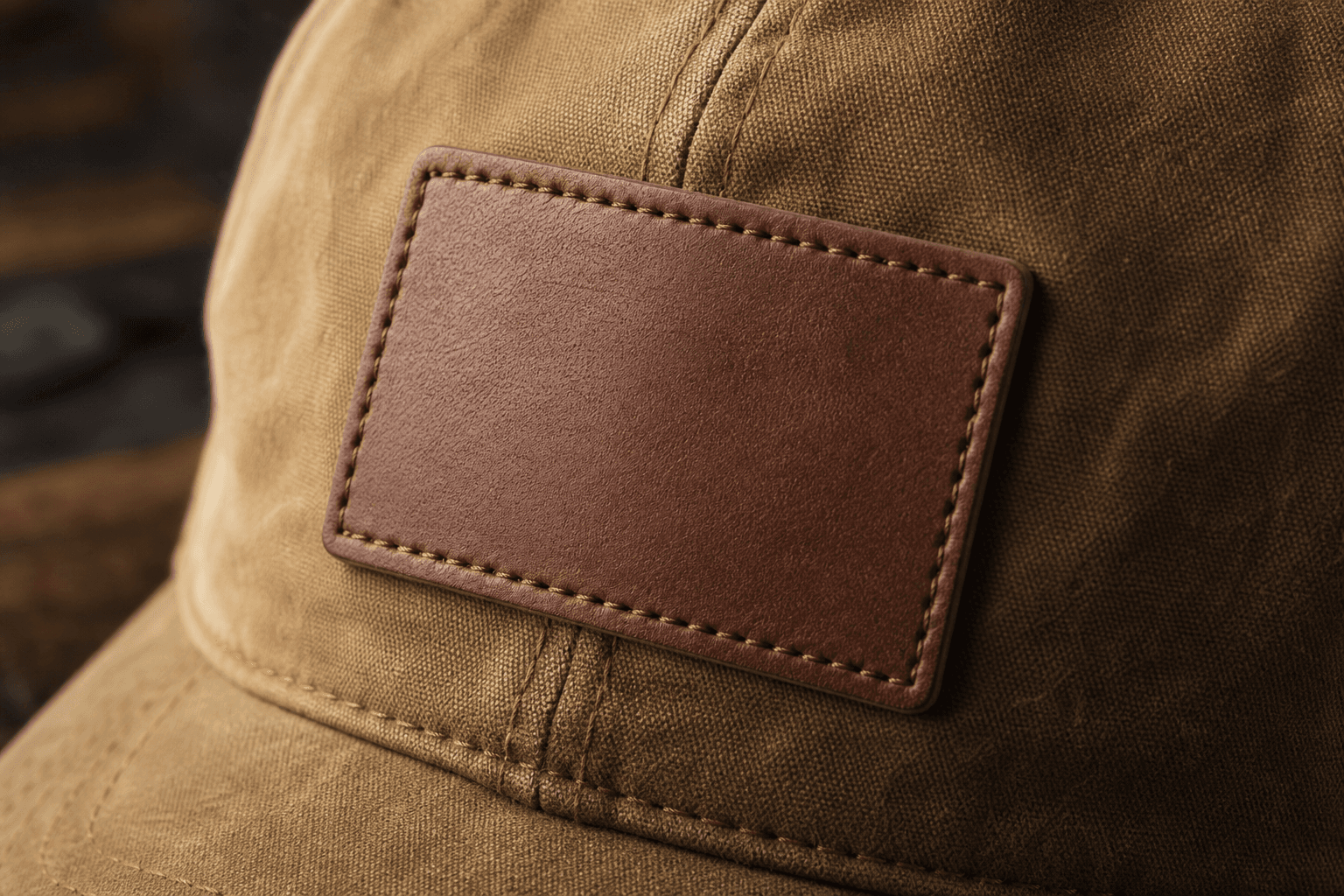 Close-up of a blank leather patch stitched on a blank cap crown